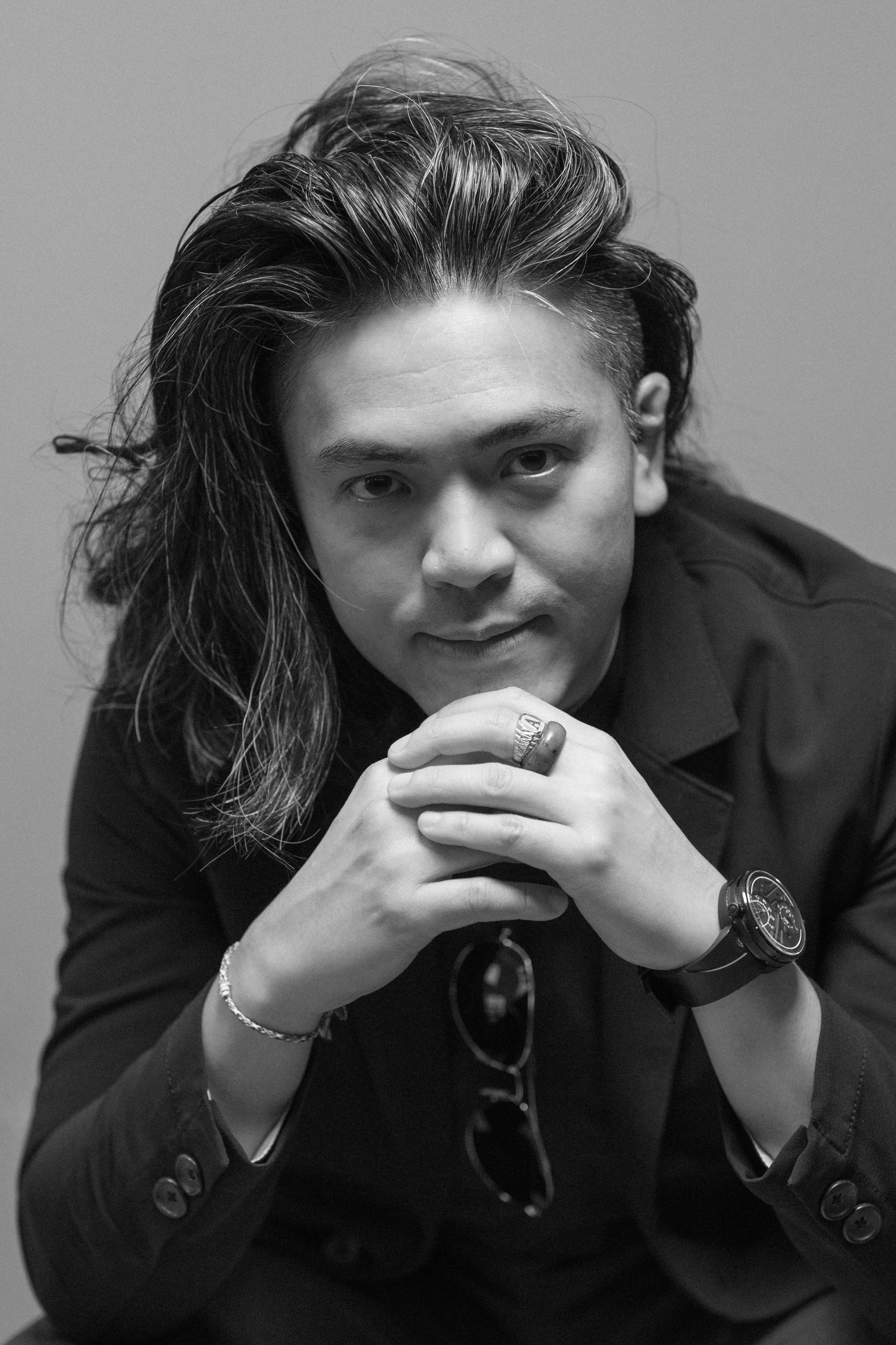 Black-and-white close portrait of Dr Aaron Kwan