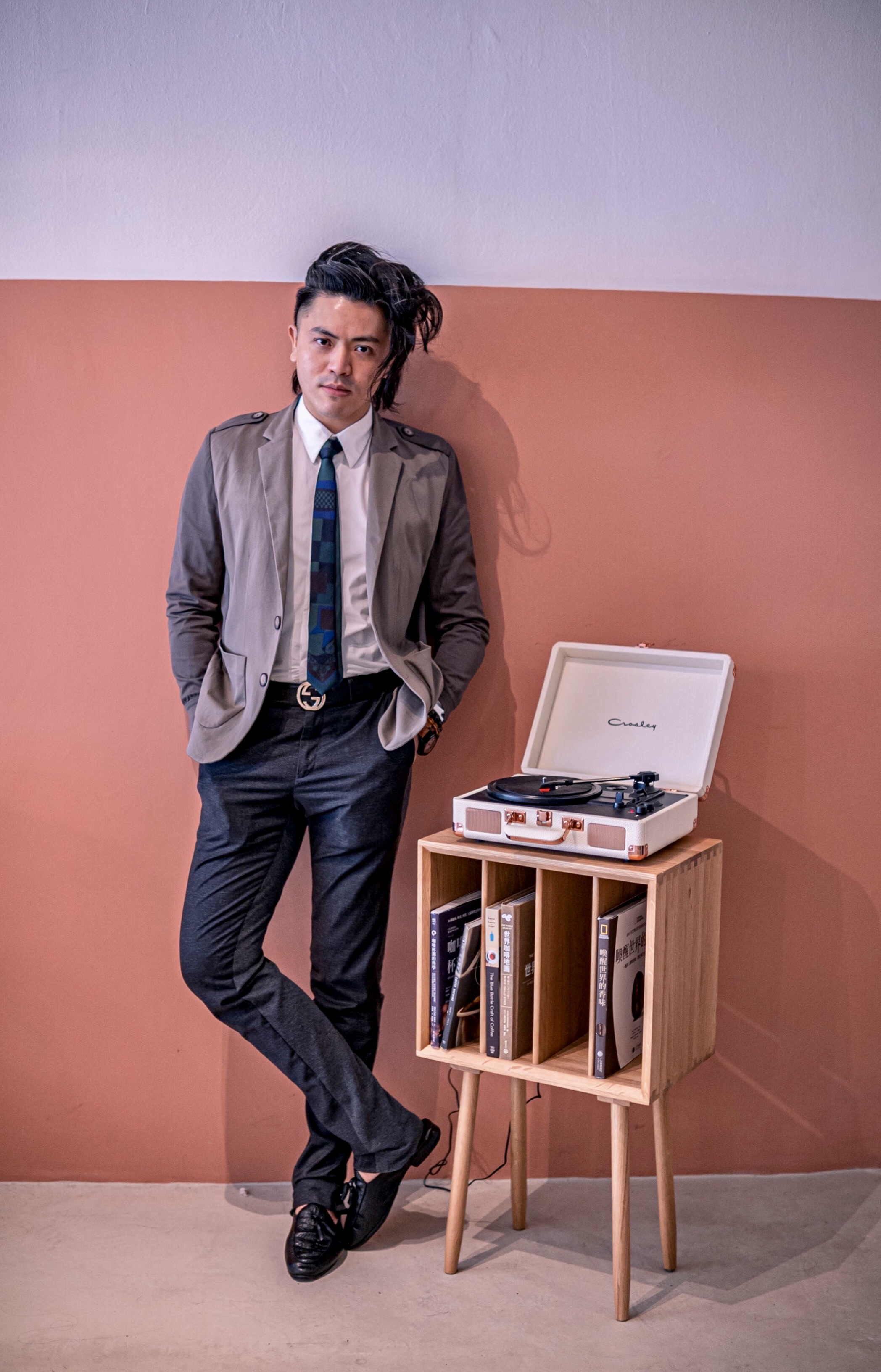 Dr Aaron Kwan reading in a studio