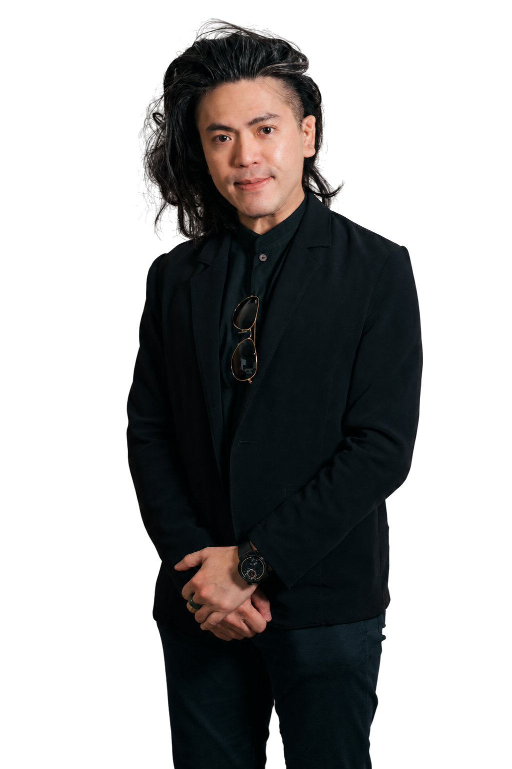 Dr. Aaron Kwan standing in a black suit